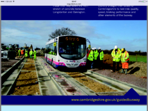 Cambridge guided bus on rails with workmen