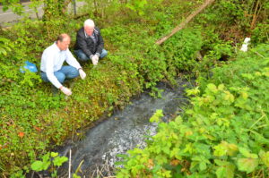 Cranleigh Society Members next to brook with raw sewage